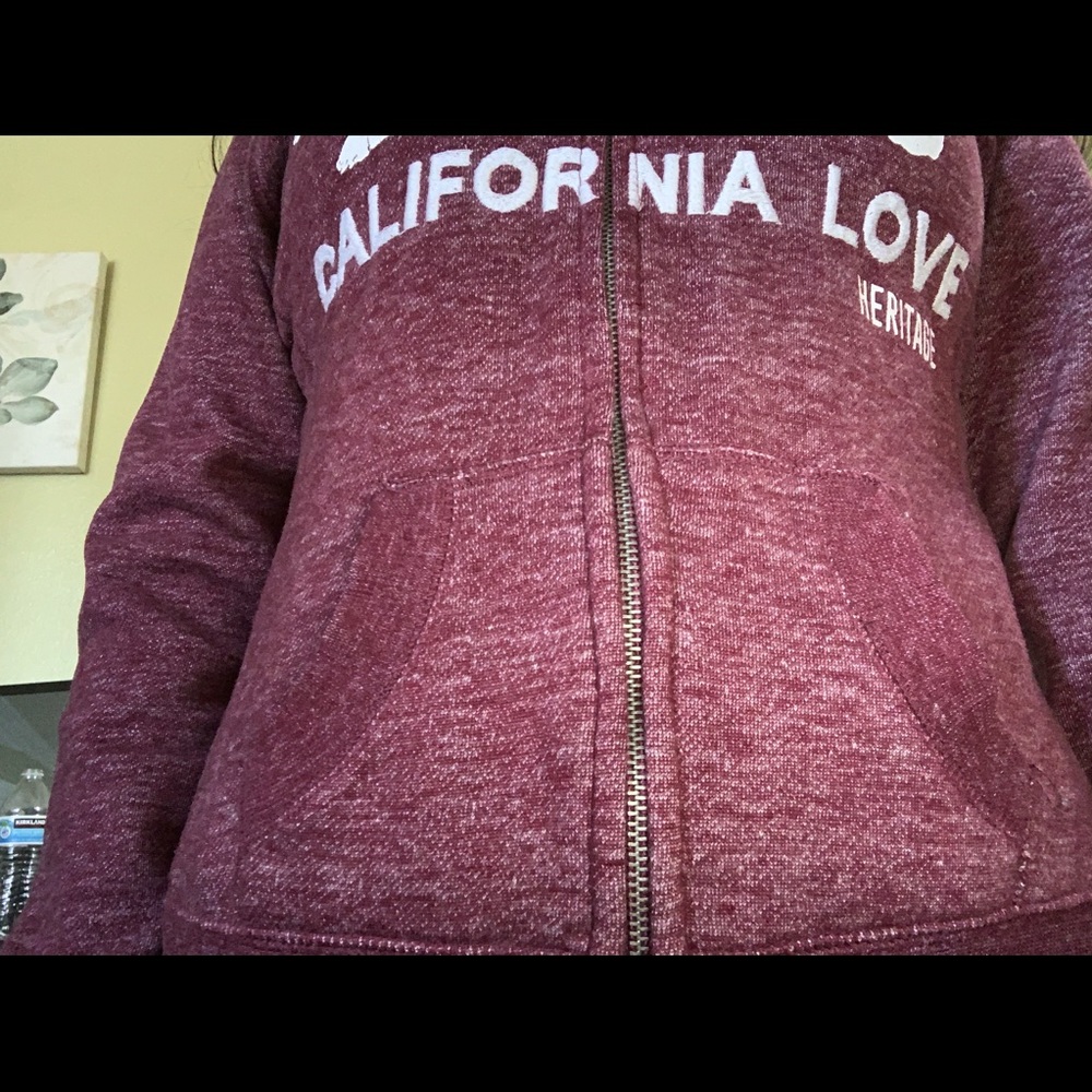 Super cute zip up sweater.